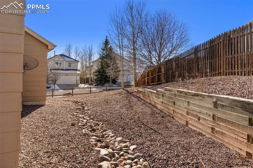 Image 25 of 25: View of fenced backyard