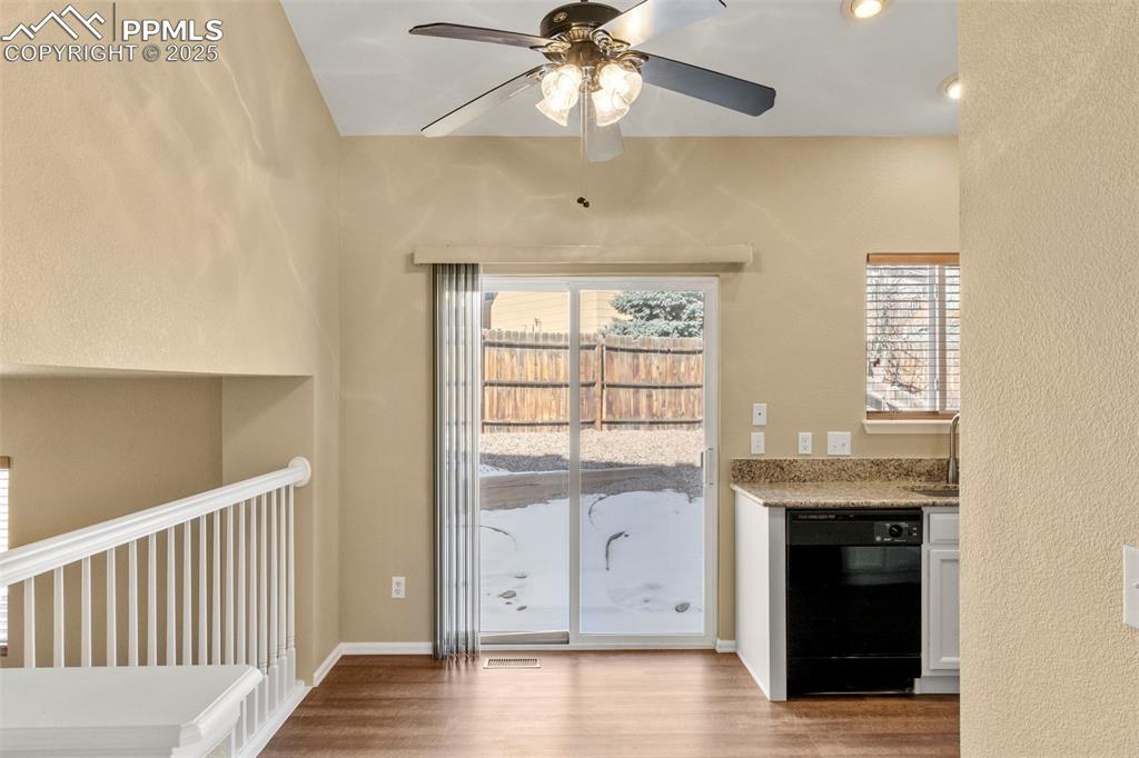 Image 8 of 25: Dining room looking into back patio