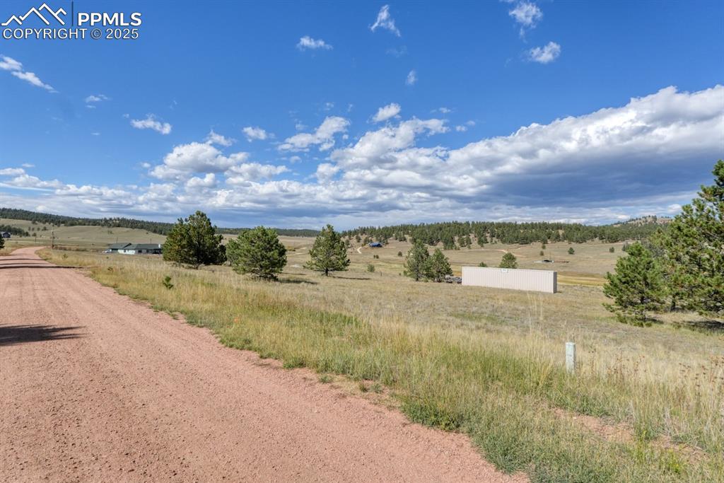 Image 10 of 16: Gravel road at front of property