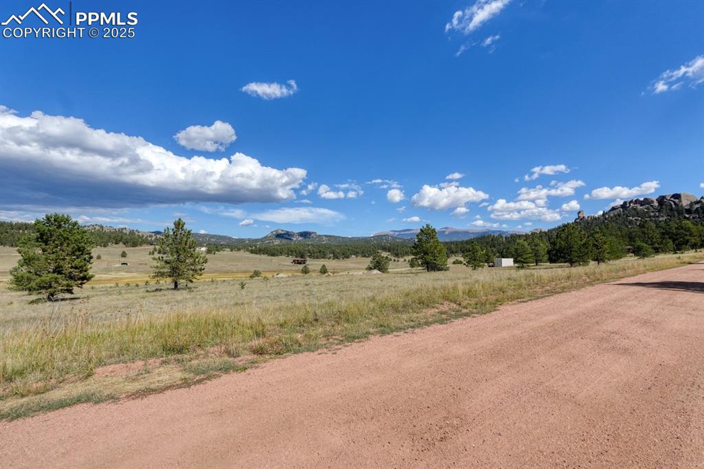Image 12 of 16: View of mountain background with rural landscape