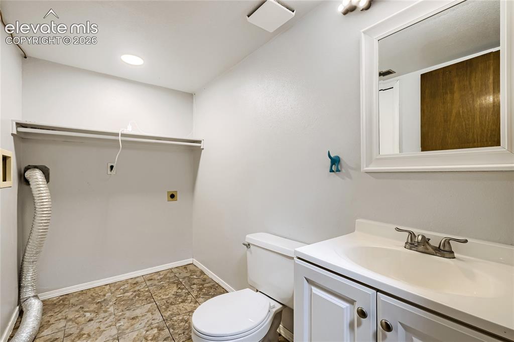 Image 14 of 26: Lower Level Laundry and Half Bath