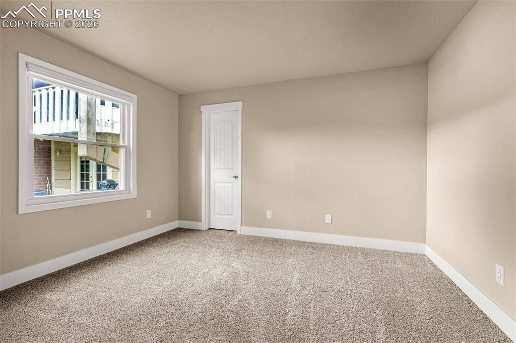 Image 8 of 21: Unfurnished room featuring light carpet and baseboards