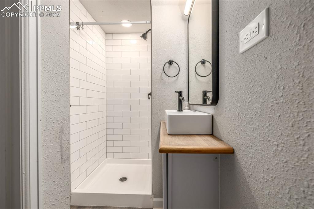 Image 17 of 28: The basement features a 3/4 updated bathroom