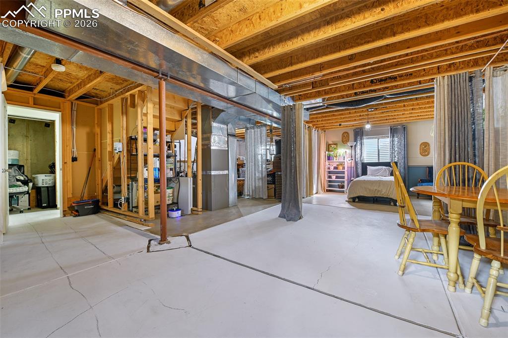 Image 19 of 27: Basement with heating unit