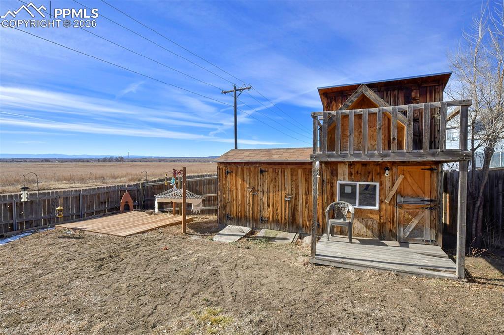 Image 27 of 27: View of outbuilding with a fenced backyard