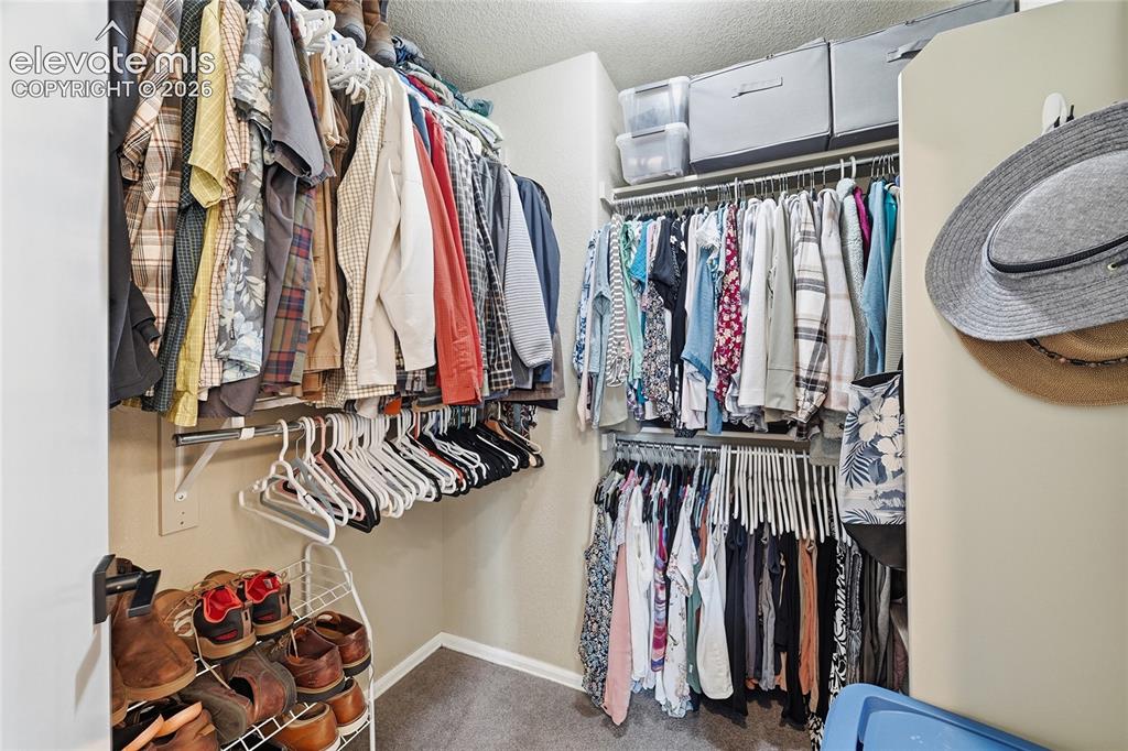 Image 26 of 49: Walk in Closet