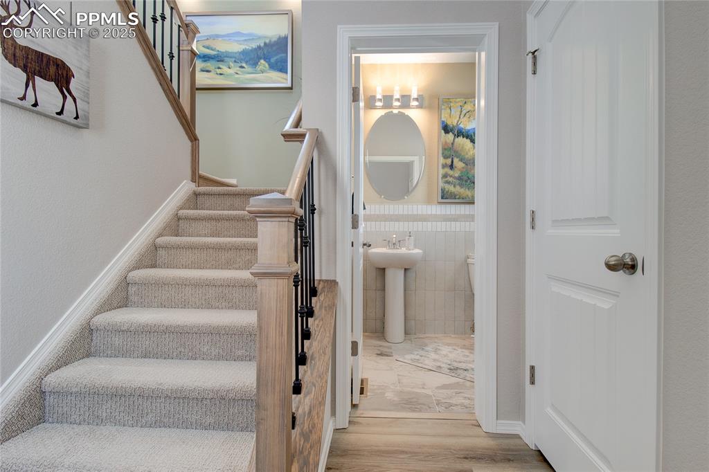 Image 3 of 23: Stairs featuring a wainscoted wall