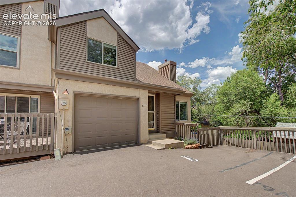 Image 1 of 30: Exterior with an attached garage, featuring horizontal siding and stucco fi
