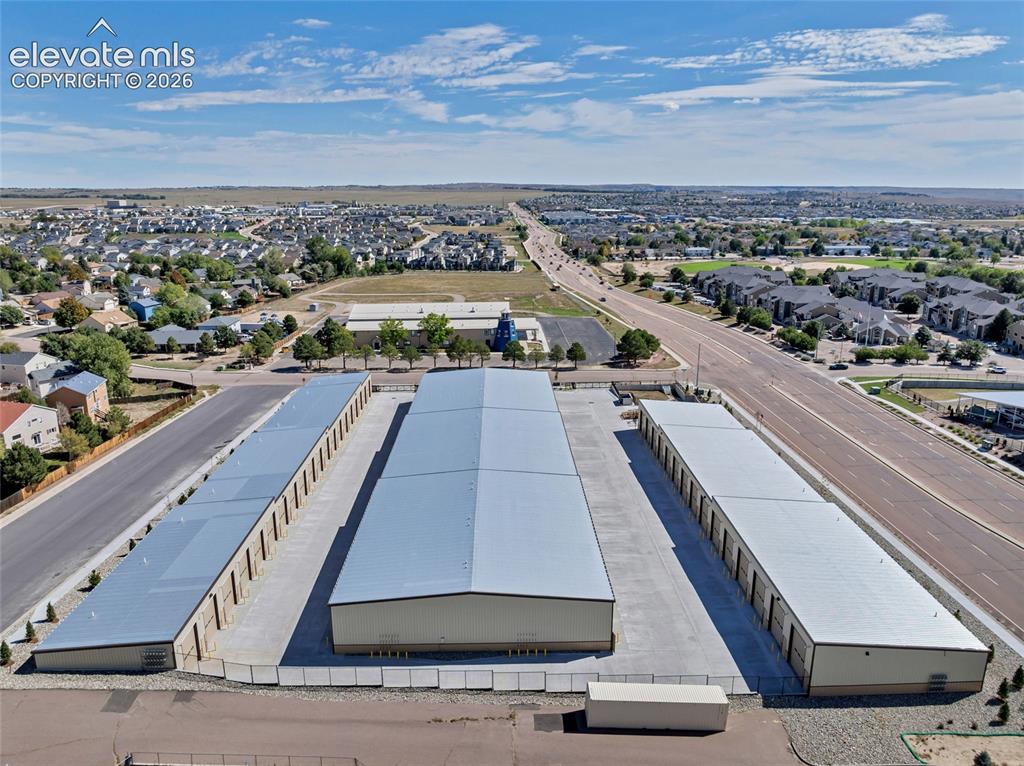 Image 13 of 20: Multiple storage buildings with metal roofs