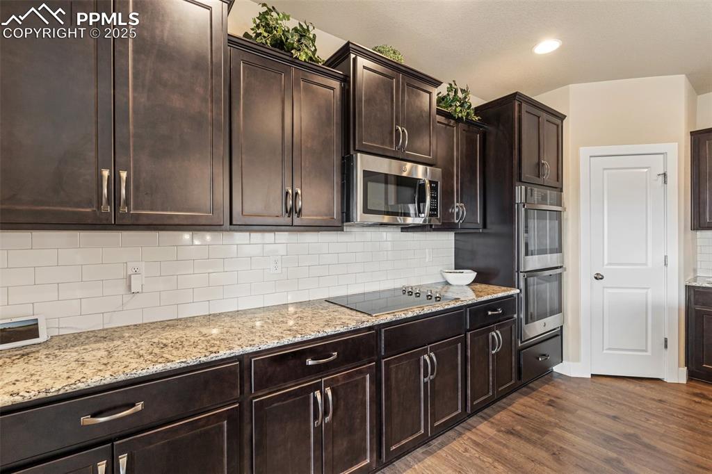Image 18 of 49: Full height subway tile backsplash