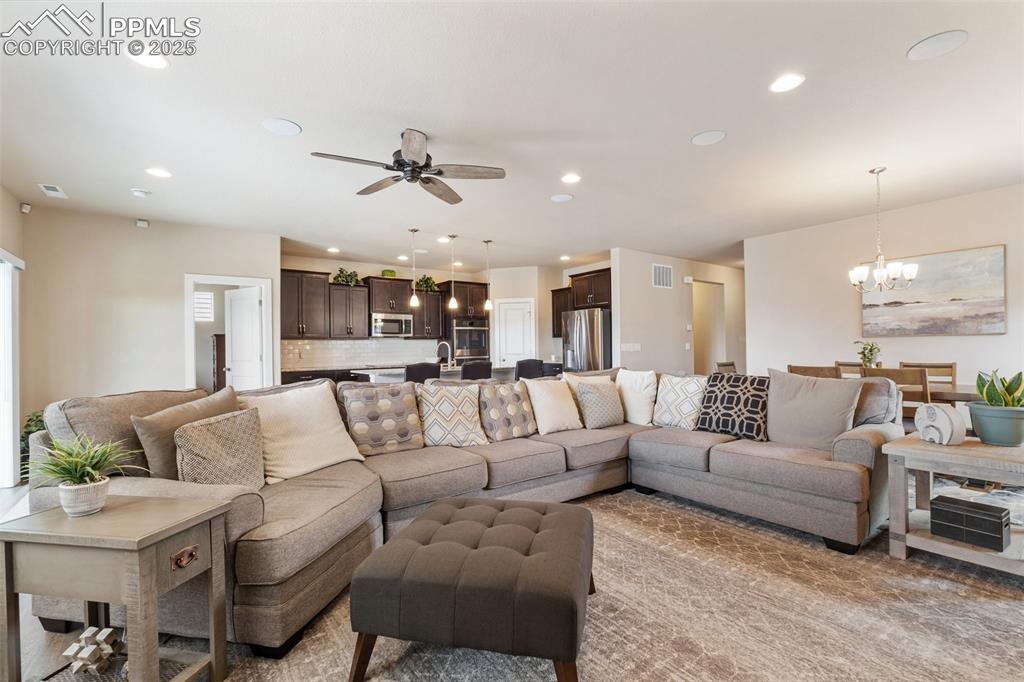 Image 21 of 49: Enjoy the space with family and friends or cozy up for your favorite movie/