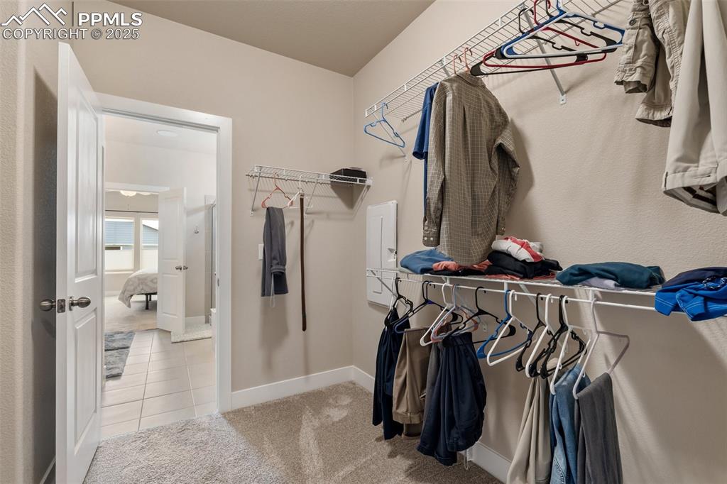 Image 31 of 49: Continue through the bathroom to a large walk-in closet