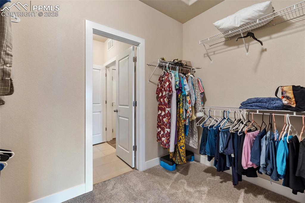 Image 33 of 49: Pass through the closet to the laundry space