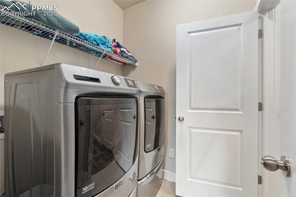 Image 34 of 49: Hidden laundry room with electric hookups