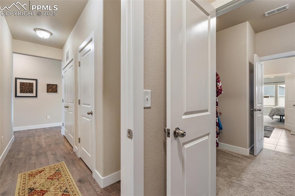 Image 35 of 49: From the laundry follow the hallway back to the entry and main living