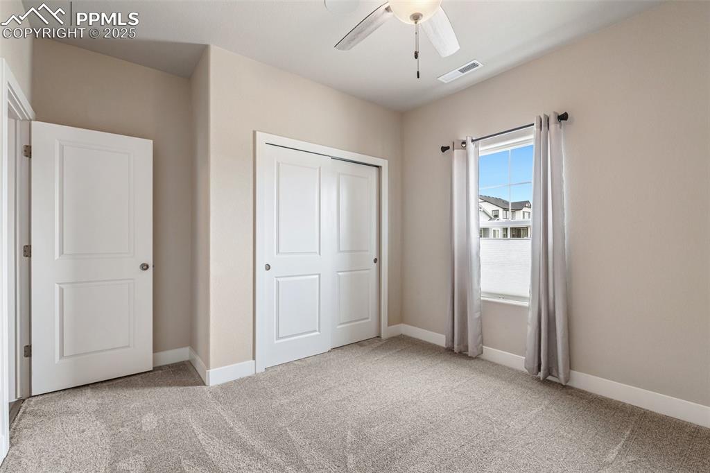 Image 6 of 49: Tall ceilings and and ceiling fan for warm days