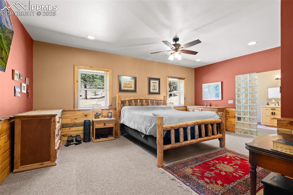 Image 19 of 40: Carpeted bedroom with recessed lighting and ceiling fan