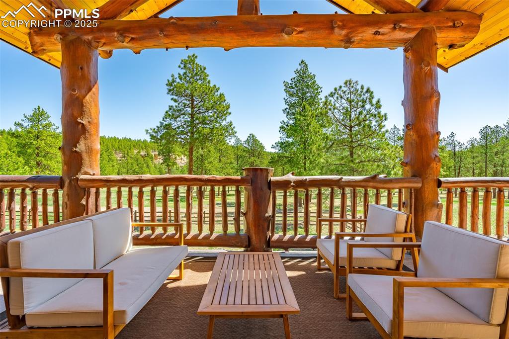 Image 9 of 40: Wooden deck featuring outdoor lounge area