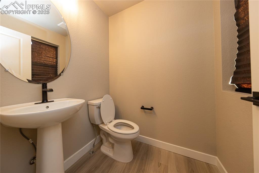 Image 6 of 32: Bathroom with baseboards and light wood-style floors