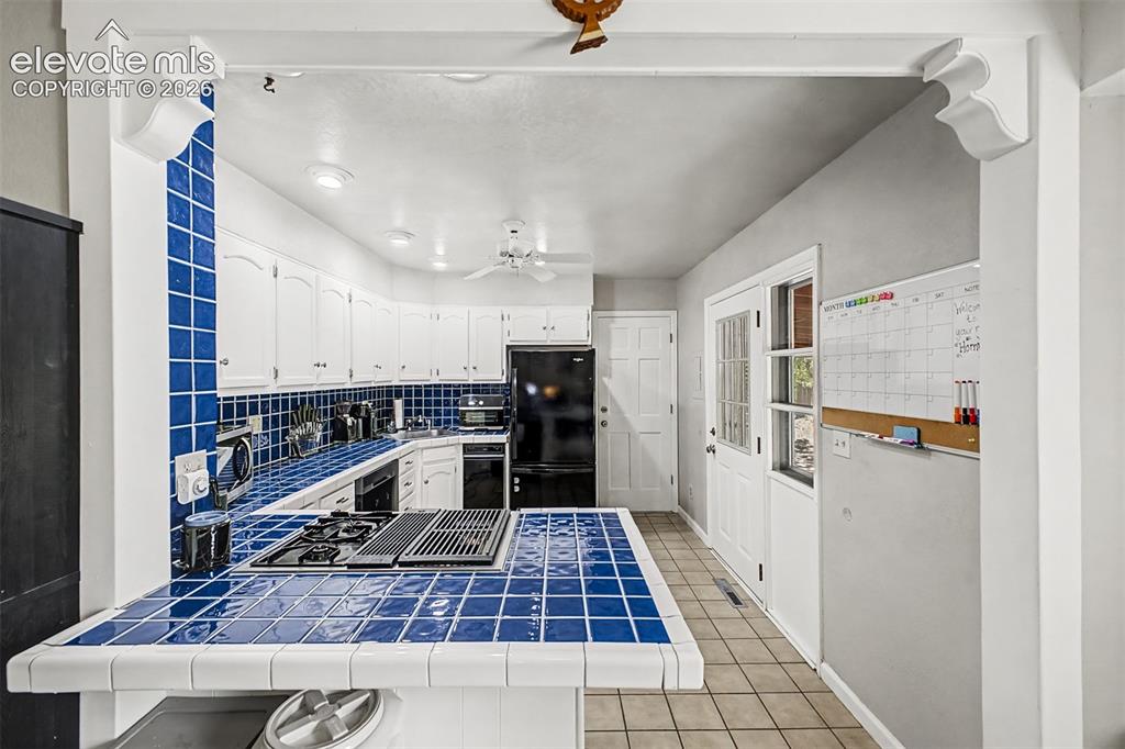 Image 10 of 44: Kitchen has walk-out to large covered patio and also a door to the laundry
