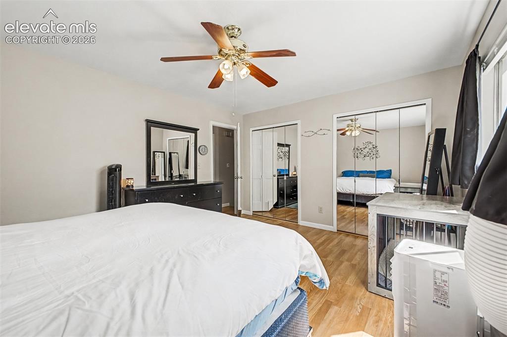 Image 15 of 44: Primary bedroom features ample closet space for you.