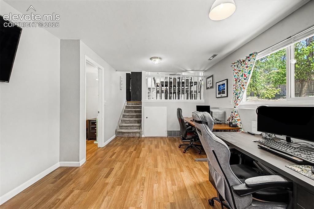 Image 20 of 44: Lower level family room with garden level windows offers lots of options fo