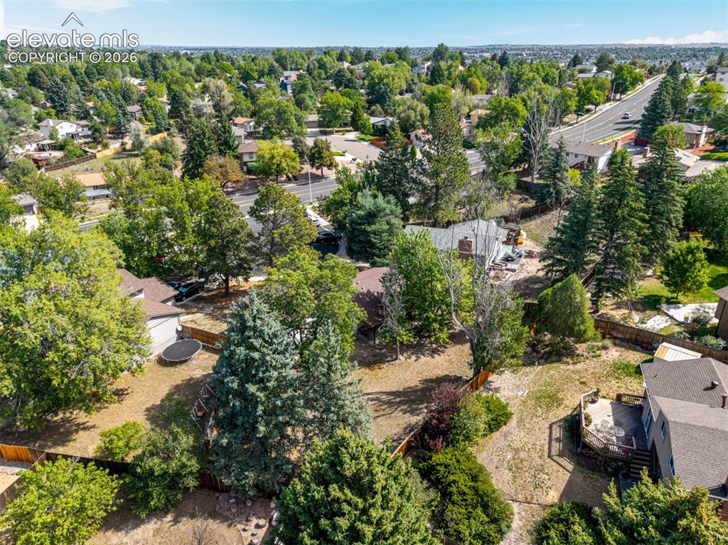 Image 35 of 44: Spacious property featuring mature trees and a multi-level deck