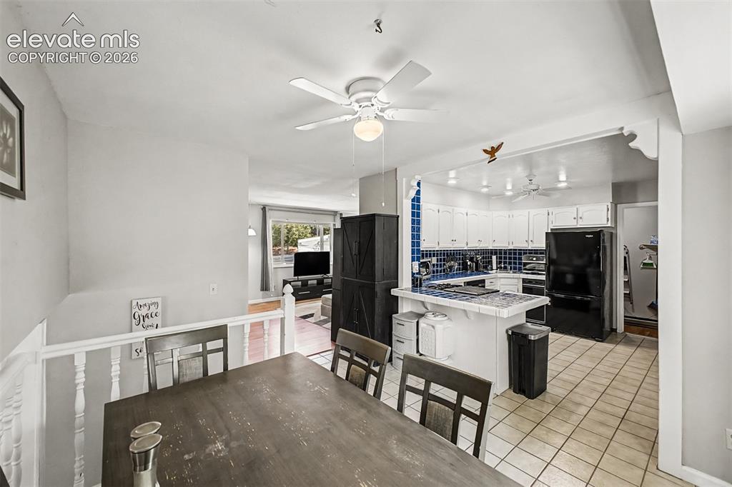 Image 8 of 44: Dining room opens to kitchen and living area for easy entertaining.