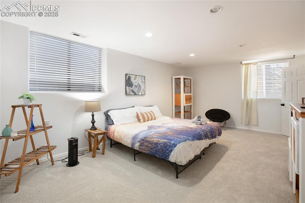 Image 37 of 47: Bedroom featuring light carpet and recessed lighting
