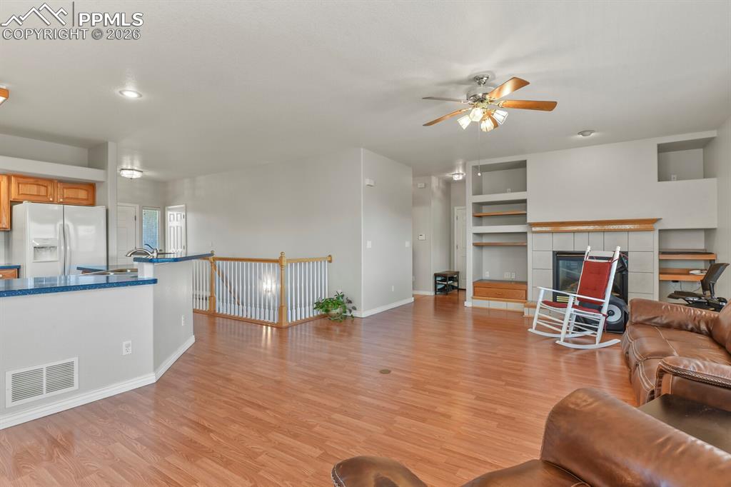 Image 9 of 45: Cozy gas fireplace and built-ins!