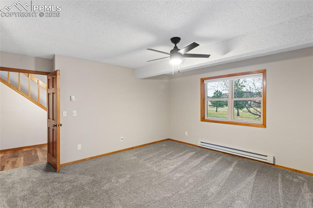 Image 14 of 40: Main Level Primary Bedroom with Ensuite 5 Piece Bathroom