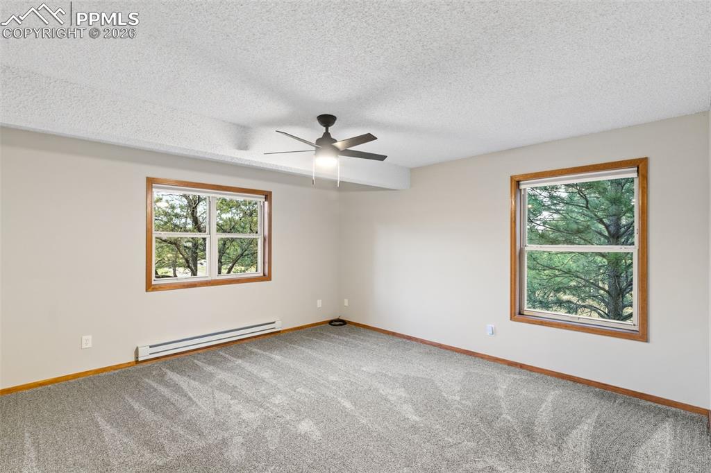 Image 15 of 40: Main Level Primary Bedroom with Ensuite 5 Piece Bathroom