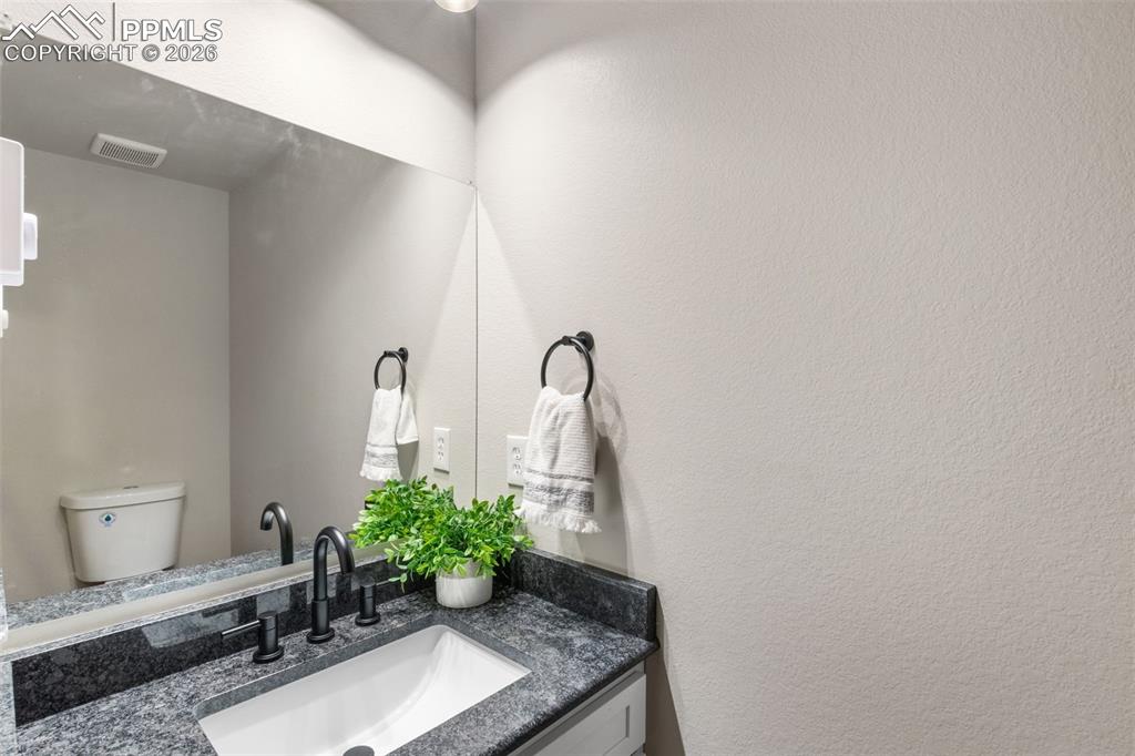 Image 21 of 40: Main level Half Bathroom