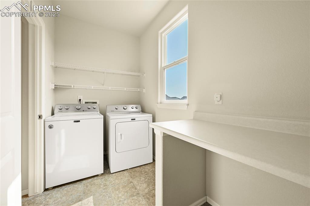 Image 13 of 28: Laundry room with washer and dryer