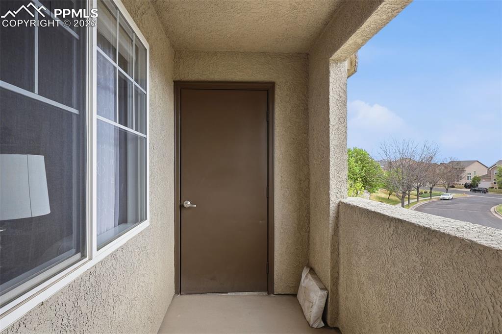 Image 10 of 32: Enjoy relaxing on the balcony with views of the mountains and city lights. 