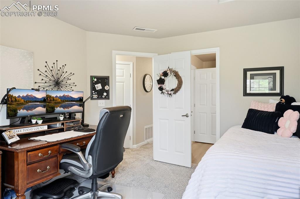 Image 17 of 32: Walk-in closet is left of the desk