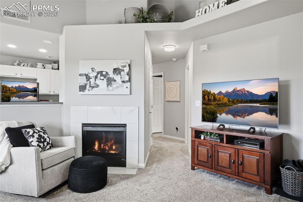 Image 4 of 32: Living Room with cozy gas fireplace