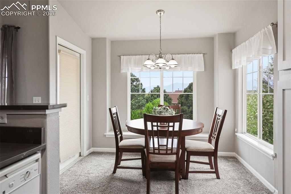 Image 9 of 32: Exit left of the dining area to the private balcony