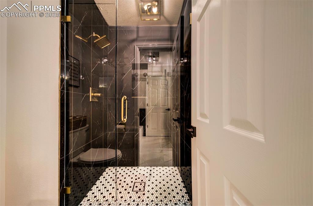 Image 34 of 40: Full bath with a stall shower