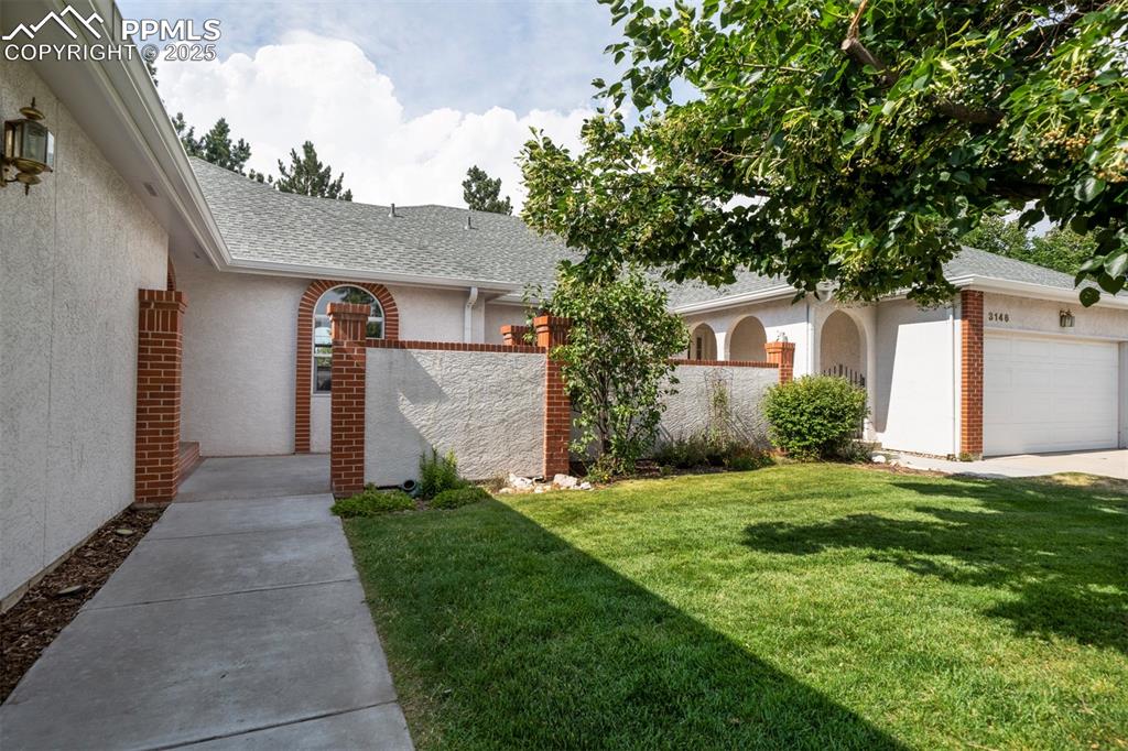 Image 4 of 40: View of yard with a garage