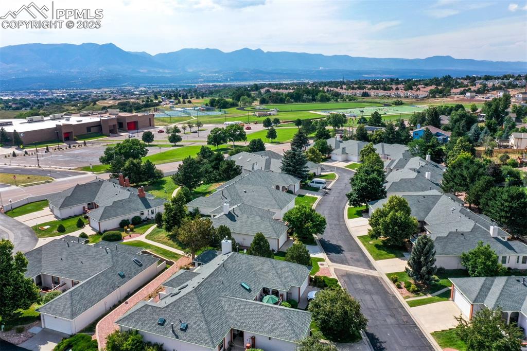 Image 6 of 40: Aerial view of residential area with mountains