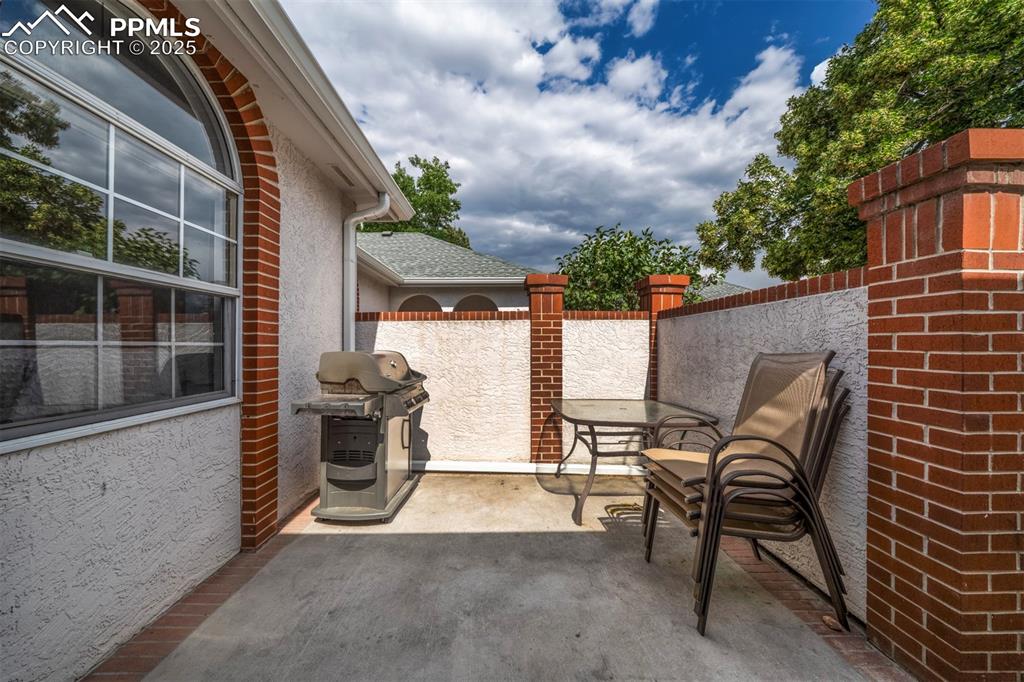 Image 8 of 40: View of patio / terrace featuring area for grilling