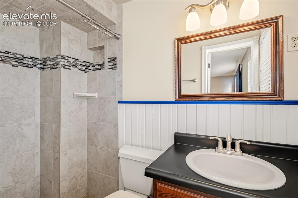 Image 21 of 30: Nicely Updated Lower Level Bath With Custom Tile Shower