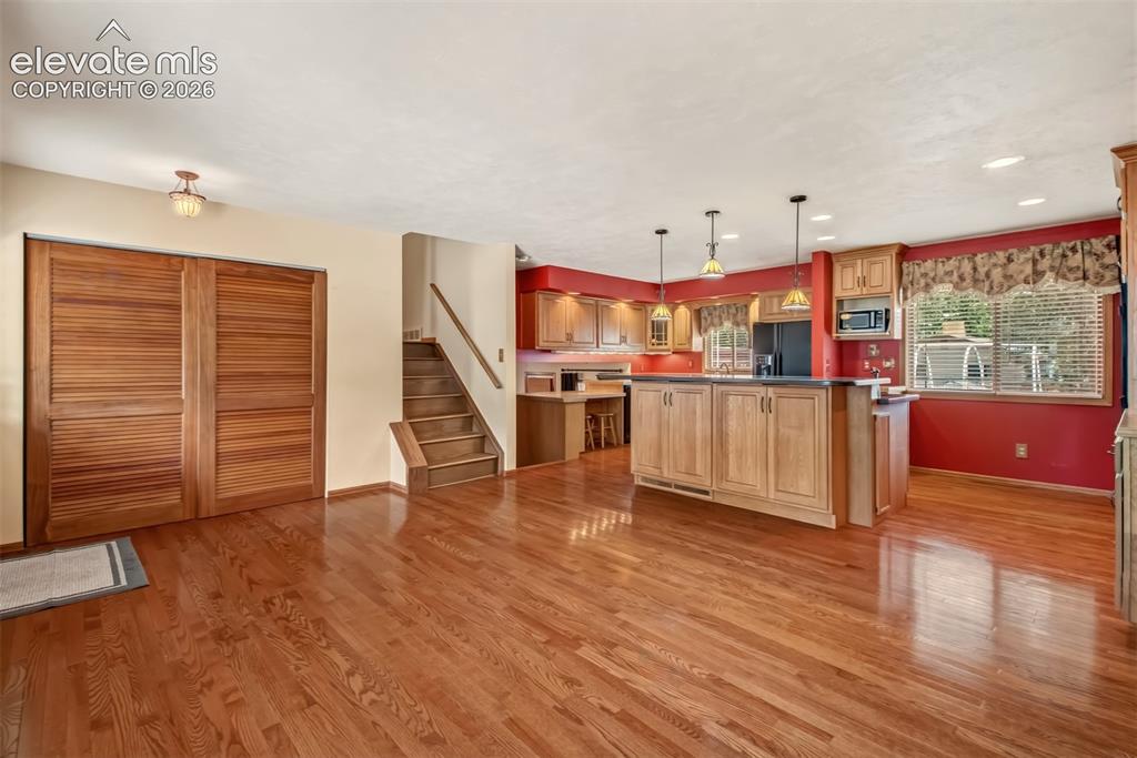 Image 7 of 30: Inviting Living Room And Kitchen