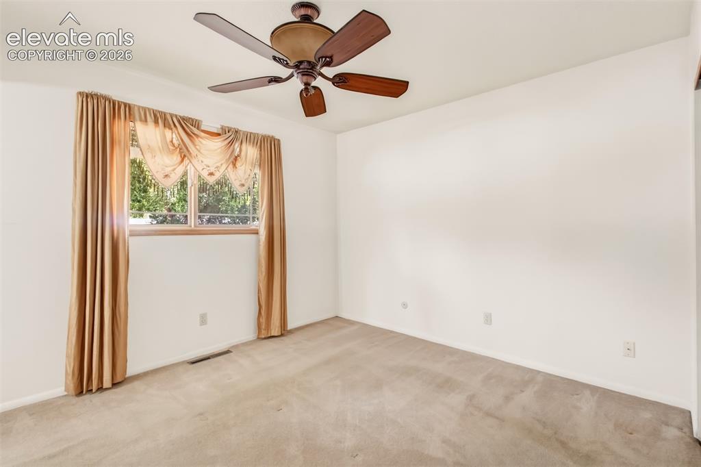 Image 9 of 30: Bedroom With Ceiling Fan (Home also has Central A/C)