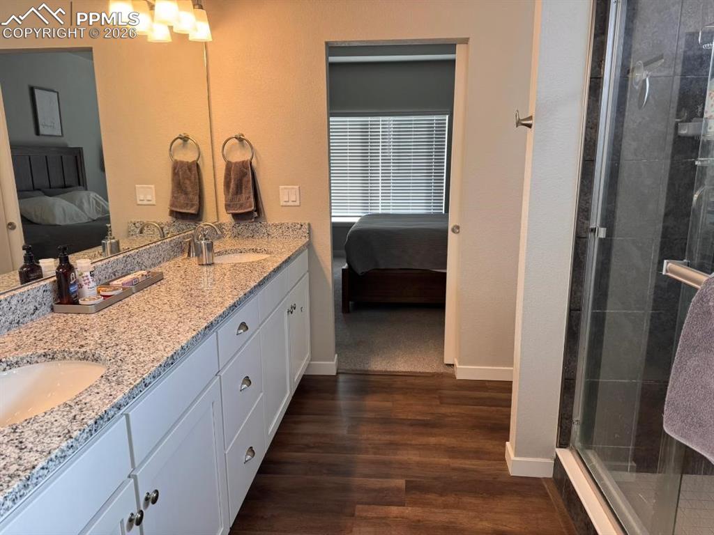 Image 15 of 42: Primary Bedroom and Bathroom