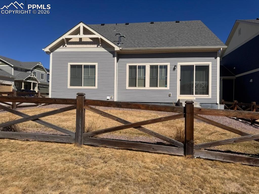 Image 38 of 42: Fenced Yard with Walking Path