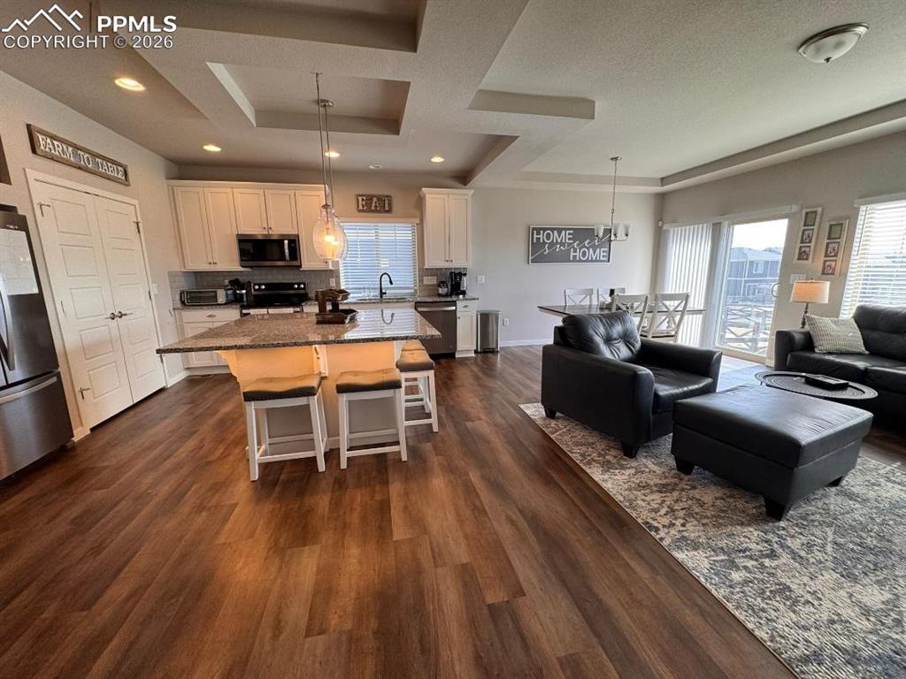 Image 6 of 42: Kitchen and Living Room