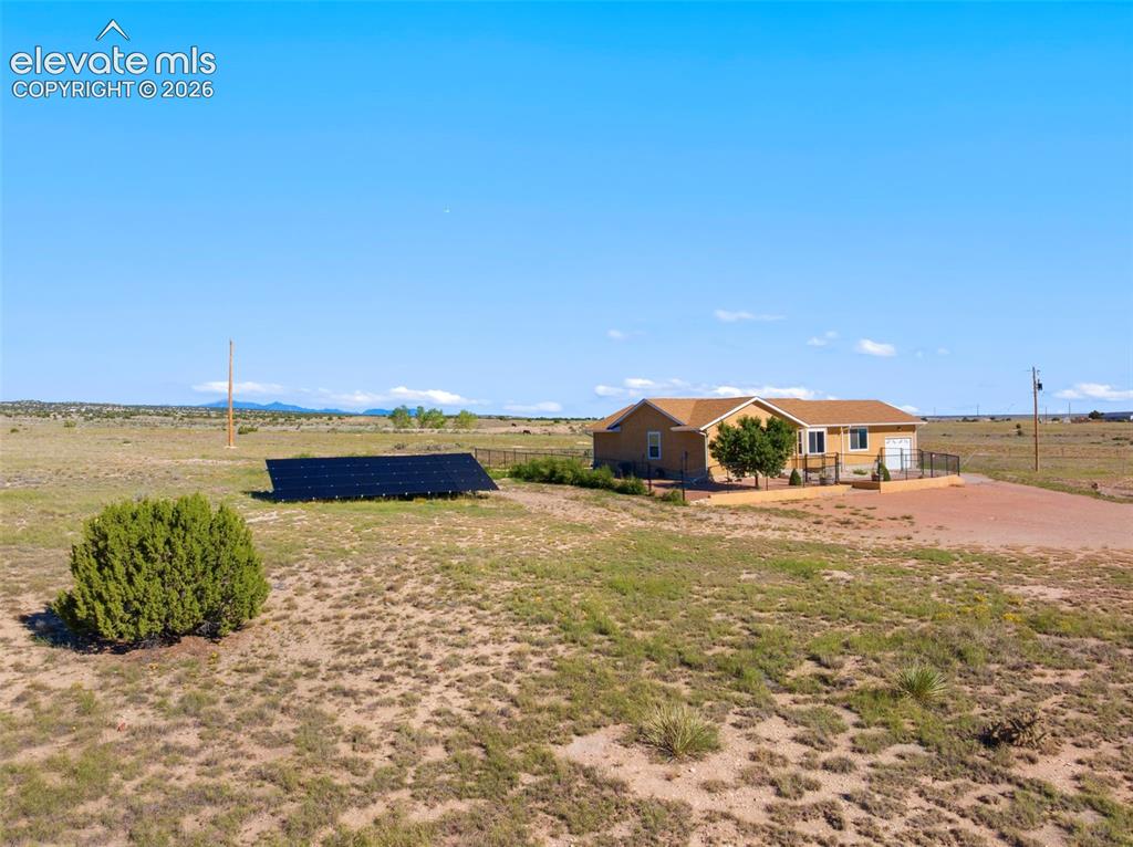 Caption: Ranch home at end of cul-de-sac, backing to Walker Ranch.
