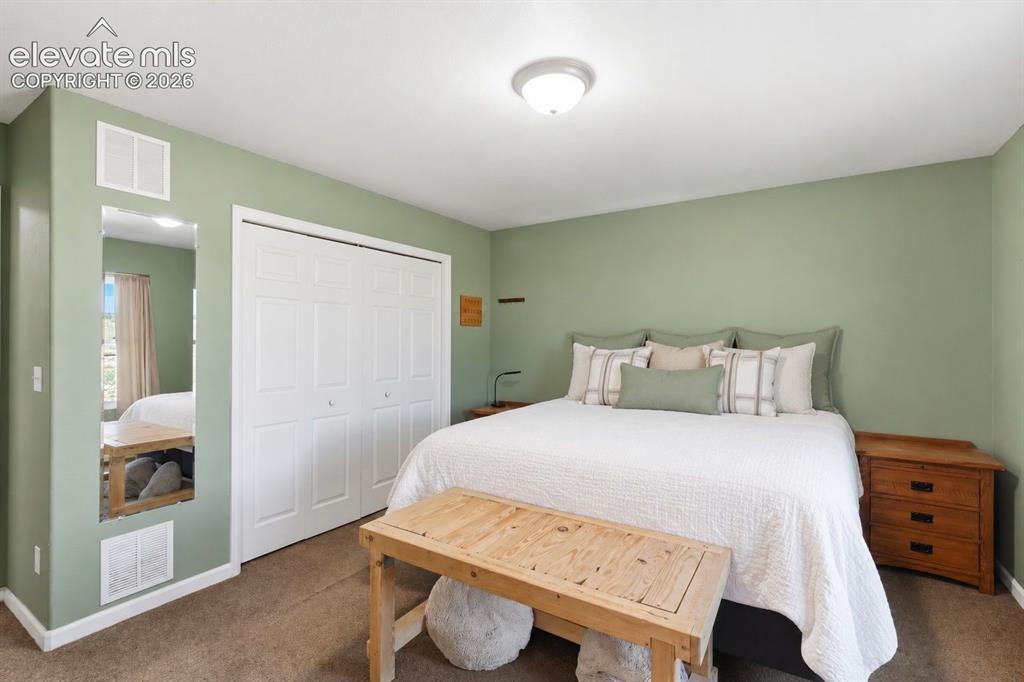 Image 13 of 24: Primary bedroom with full ensuite bathroom.